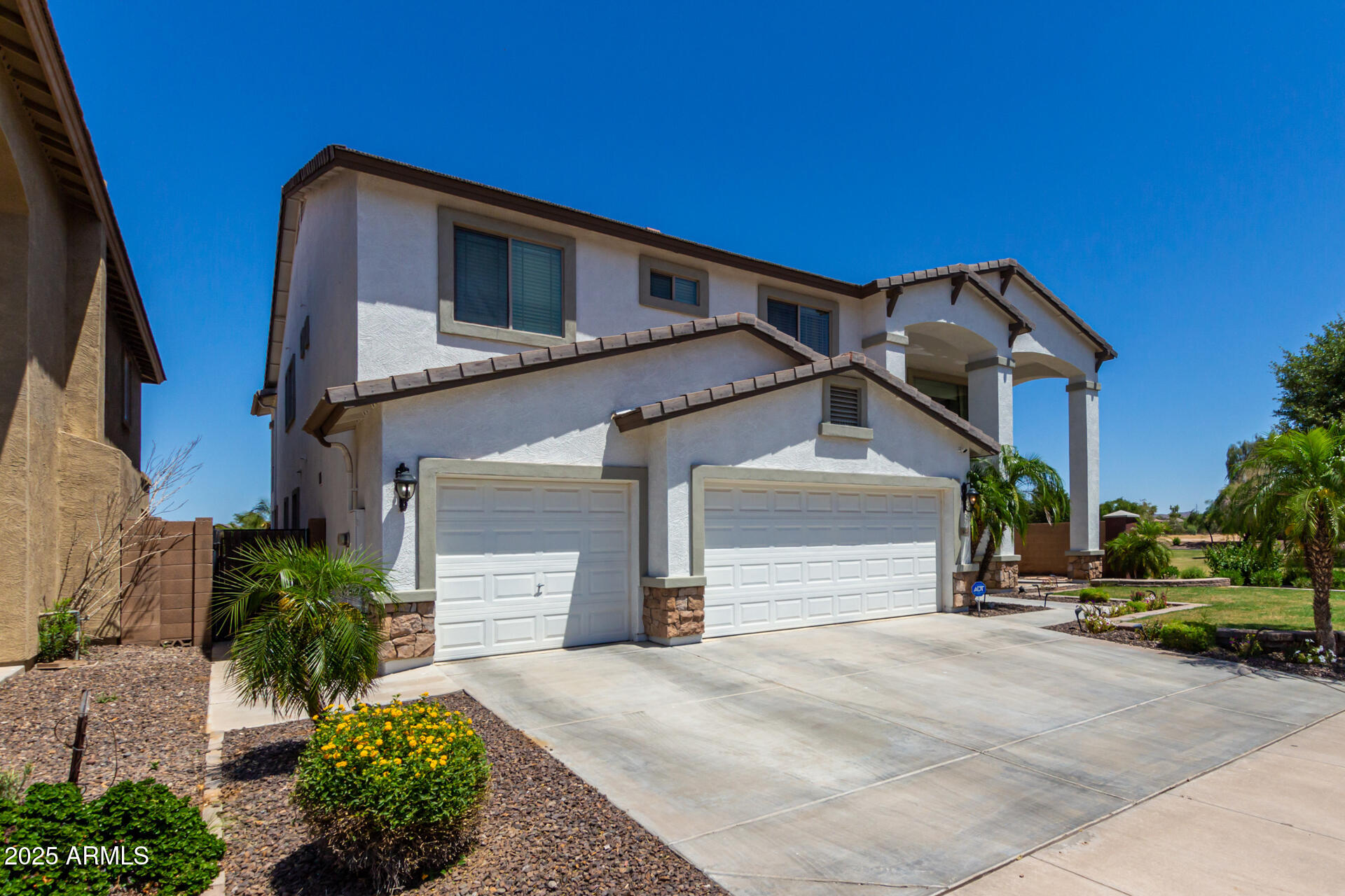 6635 South Cottonfields Lane Laveen, AZ 85339 - Photo 2 of 49 a front view of a house with a yard