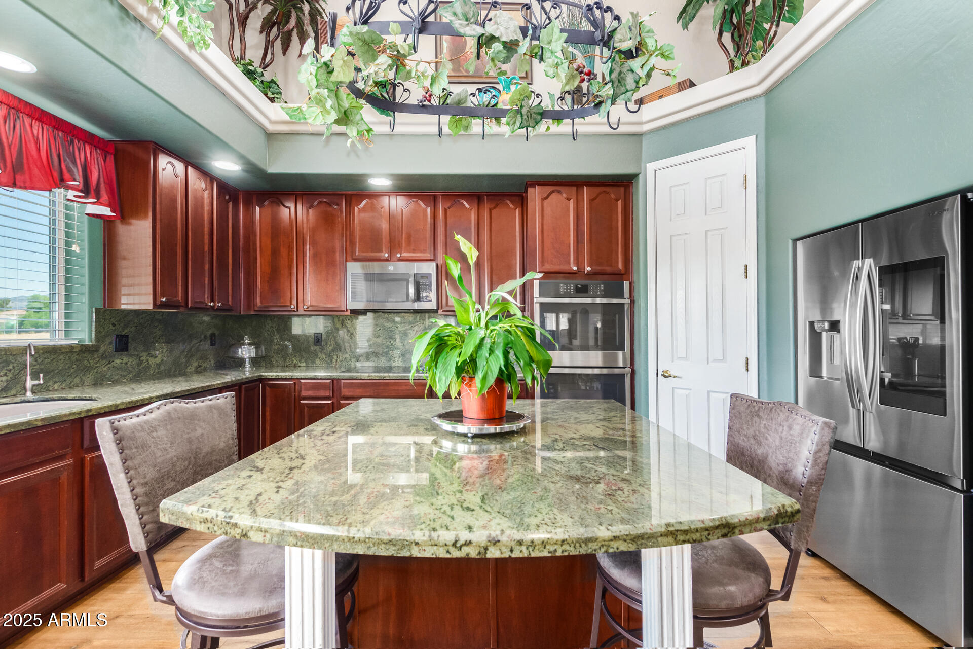 6635 South Cottonfields Lane Laveen, AZ 85339 - Photo 21 of 49 a table with chairs and window