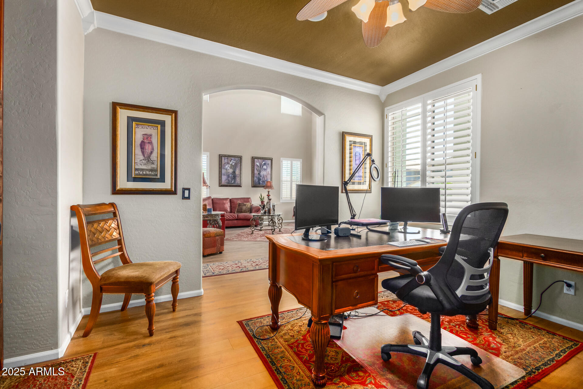 6635 South Cottonfields Lane Laveen, AZ 85339 - Photo 22 of 49 a view of a workspace with furniture and a window