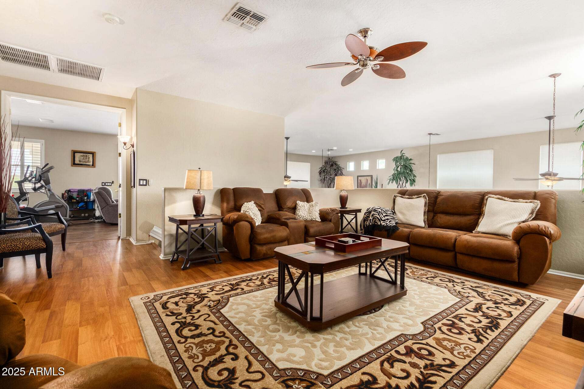 6635 South Cottonfields Lane Laveen, AZ 85339 - Photo 24 of 49 a living room with furniture a rug and a chandelier