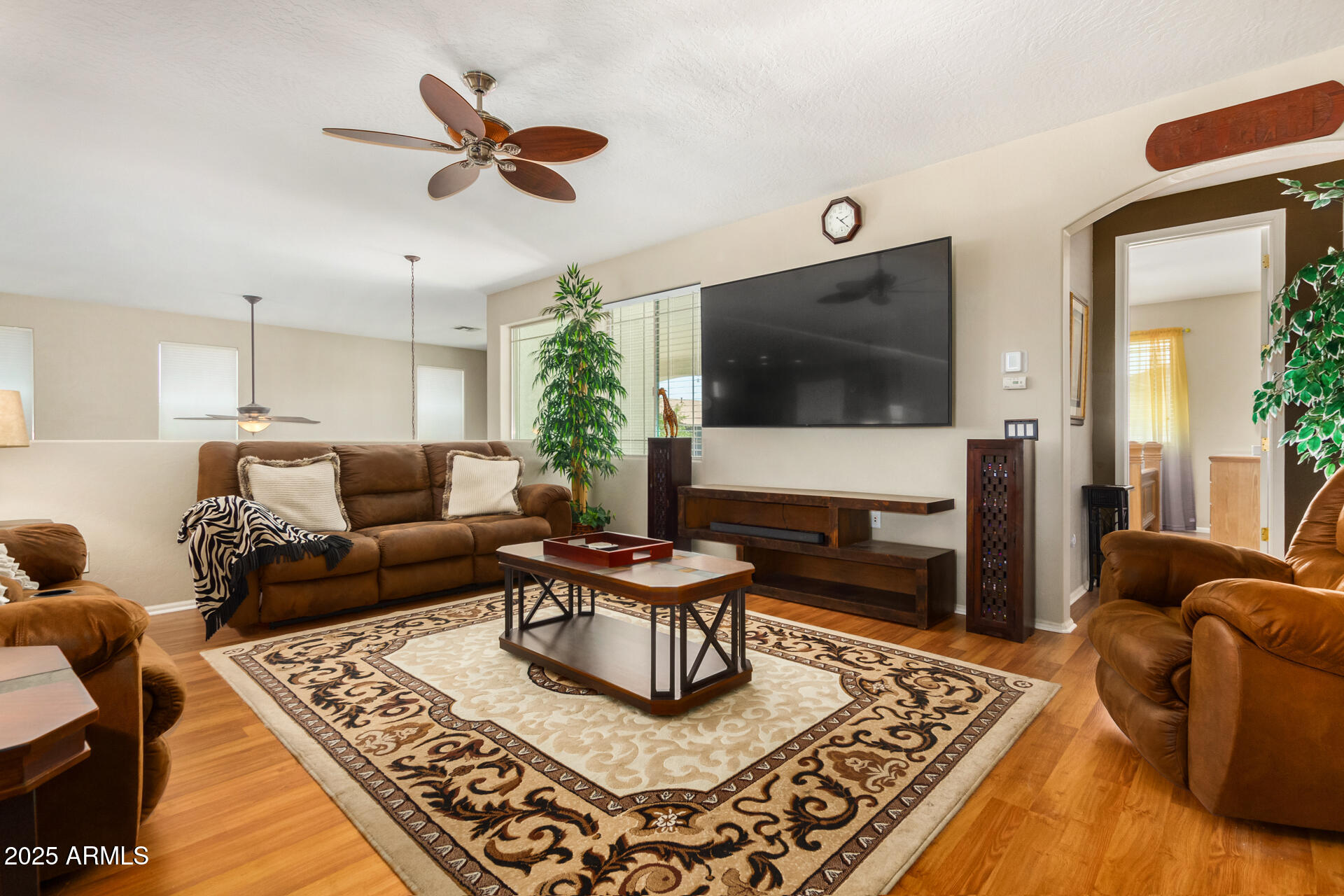 6635 South Cottonfields Lane Laveen, AZ 85339 - Photo 26 of 49 a living room with furniture and a flat screen tv