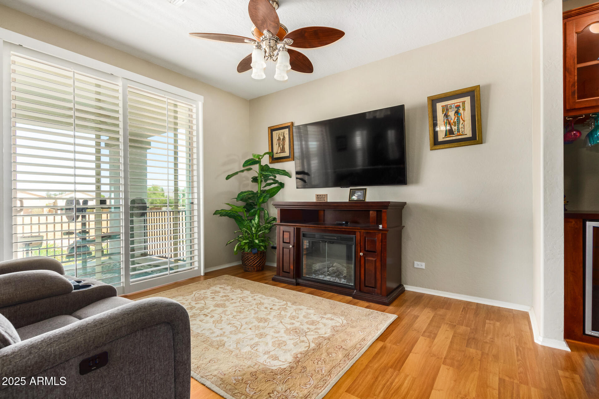 6635 South Cottonfields Lane Laveen, AZ 85339 - Photo 27 of 49 a living room with furniture and a flat screen tv