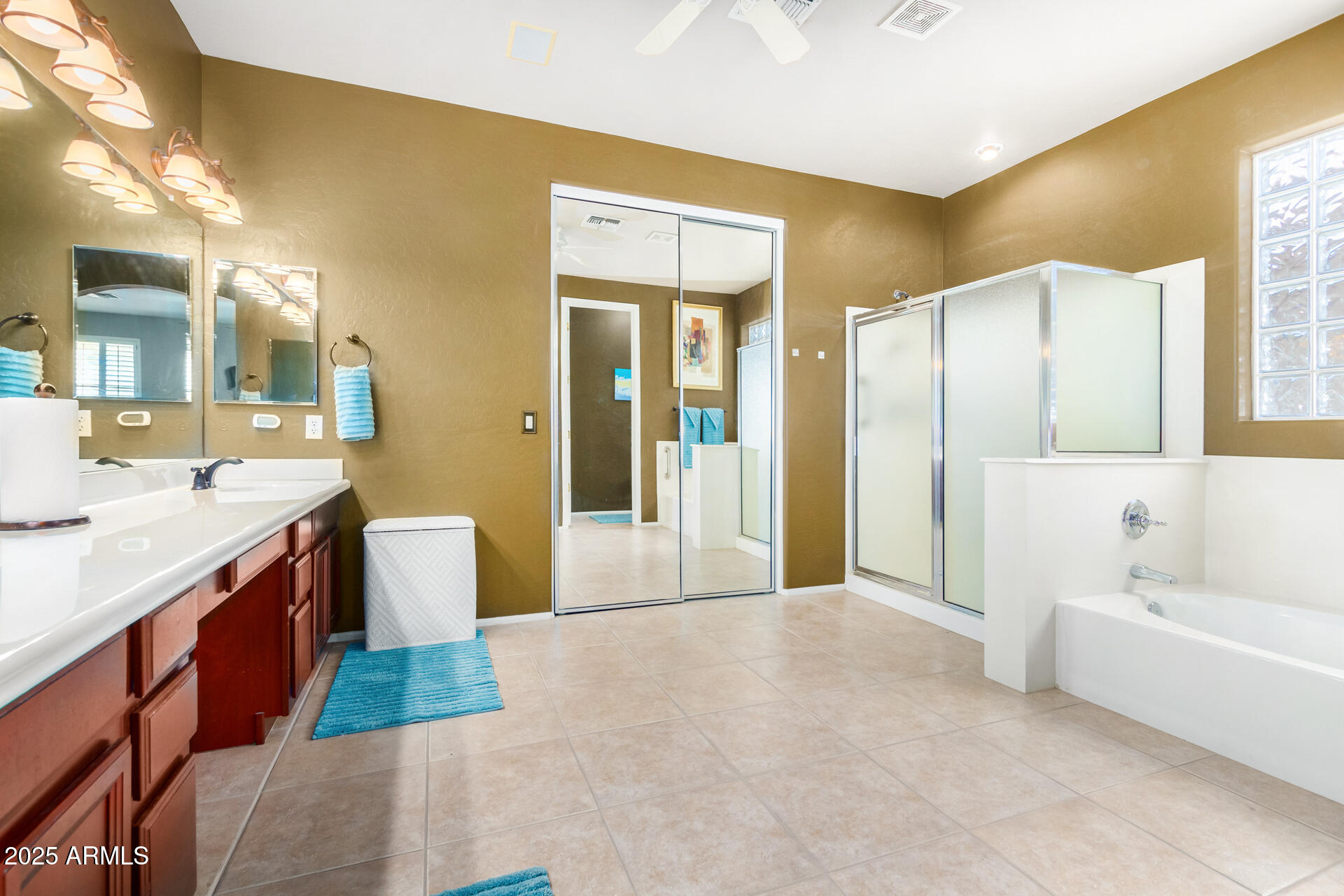 6635 South Cottonfields Lane Laveen, AZ 85339 - Photo 33 of 49 a spacious bathroom with a tub sink and mirror