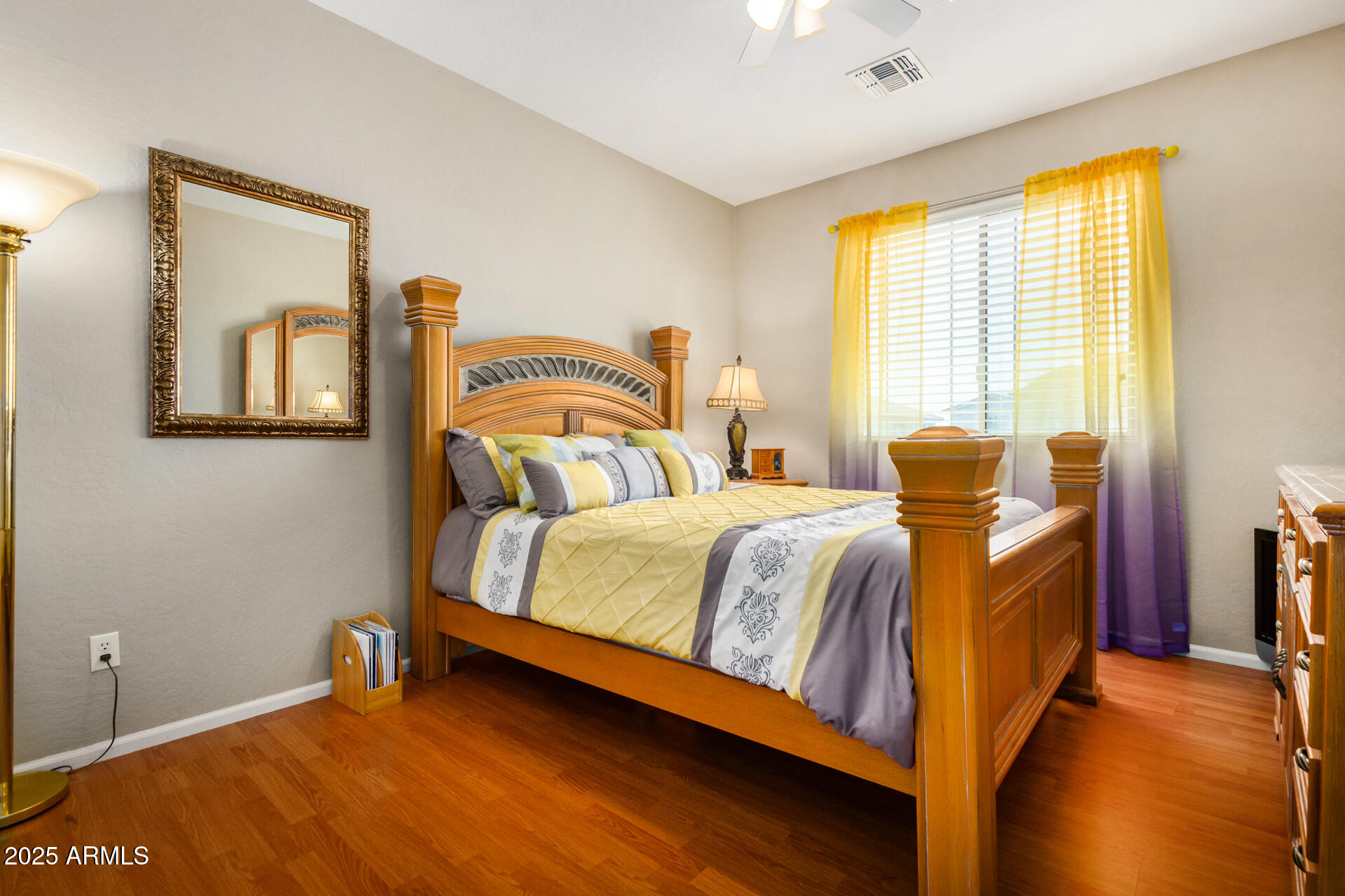 6635 South Cottonfields Lane Laveen, AZ 85339 - Photo 38 of 49 a bedroom with a bed and wooden floor