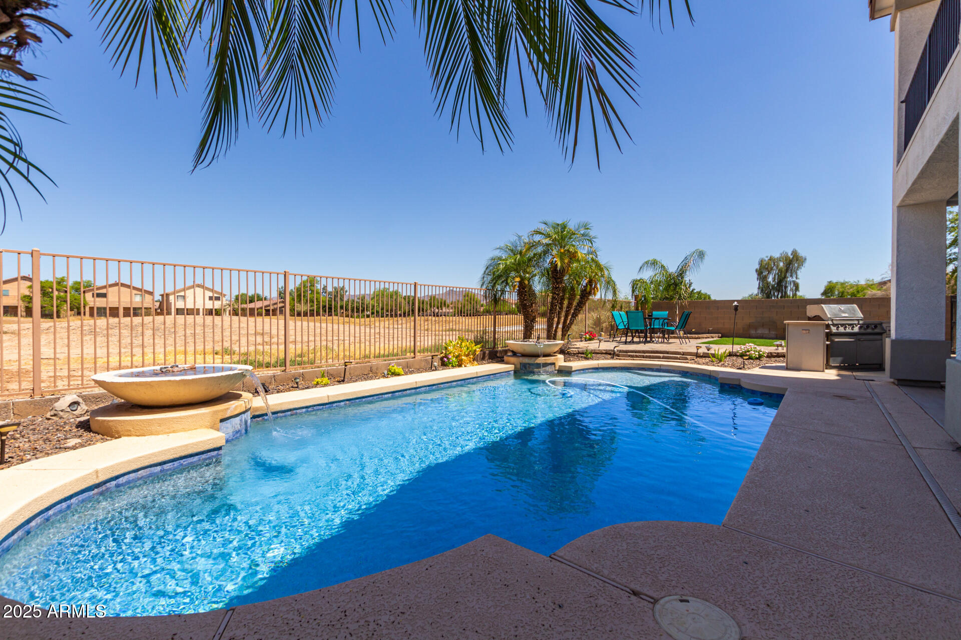 6635 South Cottonfields Lane Laveen, AZ 85339 - Photo 45 of 49 swimming pool with outdoor seating and plants