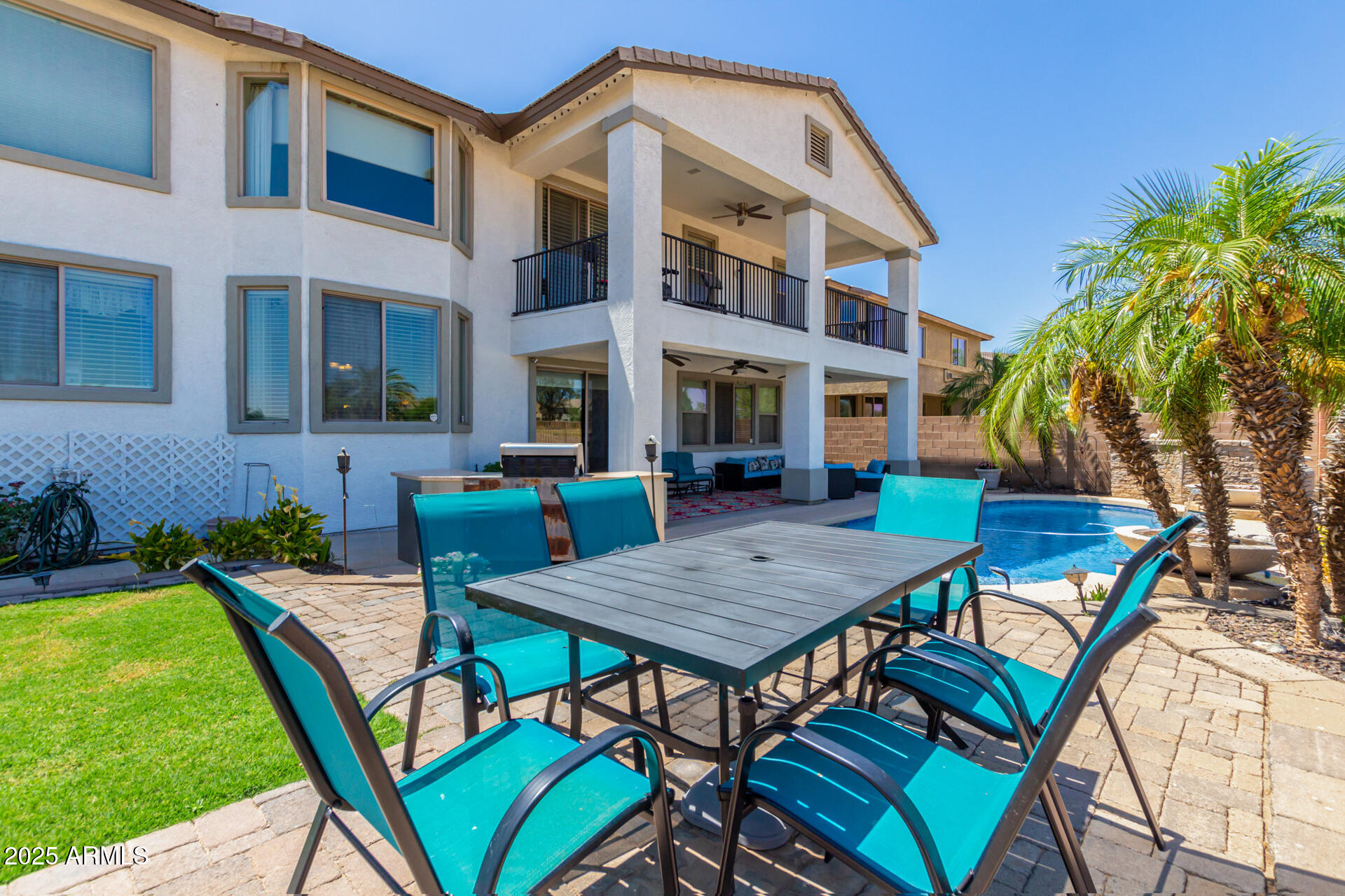 6635 South Cottonfields Lane Laveen, AZ 85339 - Photo 47 of 49 a backyard of a house with barbeque oven table and chairs