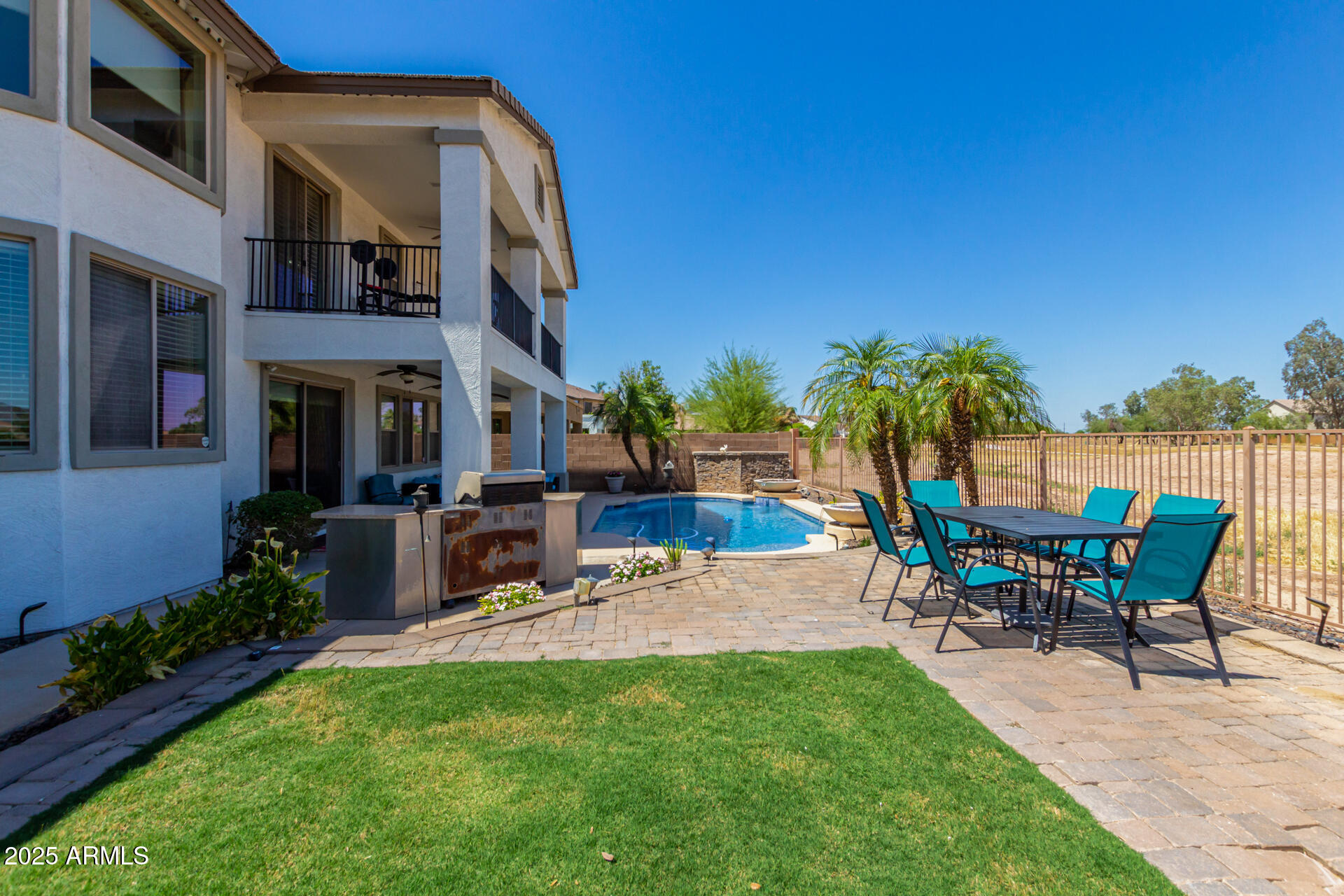 6635 South Cottonfields Lane Laveen, AZ 85339 - Photo 48 of 49 a view of backyard with outdoor seating and green space