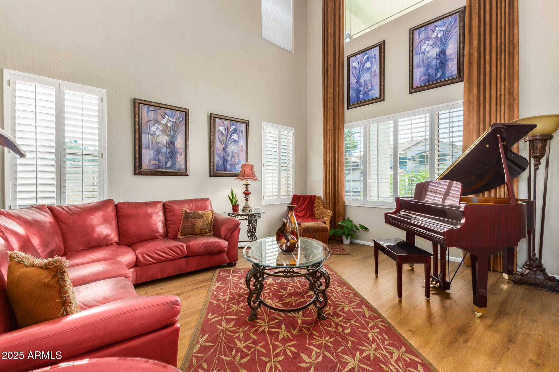 6635 South Cottonfields Lane Laveen, AZ 85339 - Photo 5 of 49 a living room with furniture wooden floor and a large window