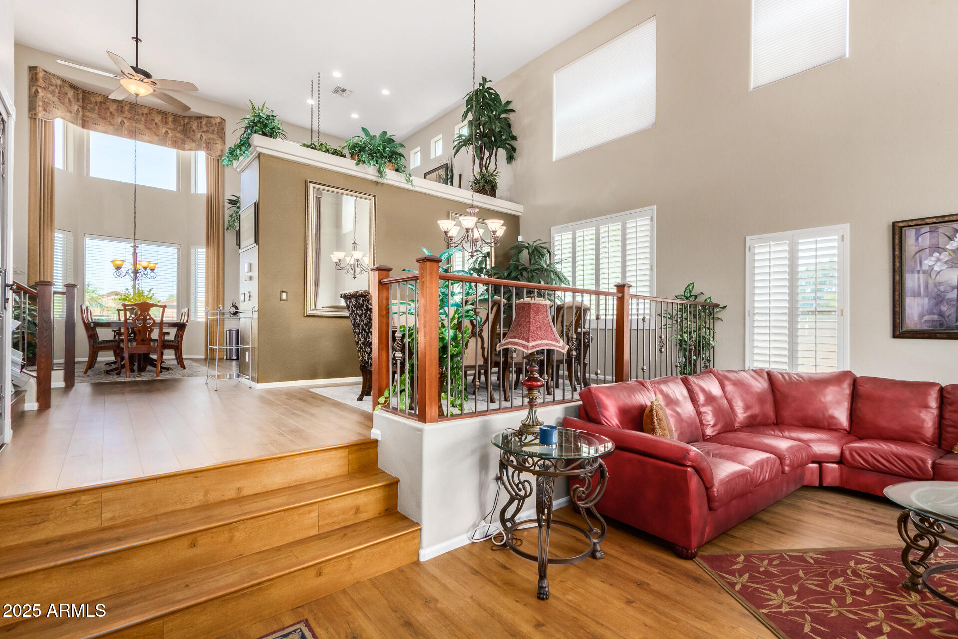 6635 South Cottonfields Lane Laveen, AZ 85339 - Photo 6 of 49 a living room with furniture a dining table and a chandelier