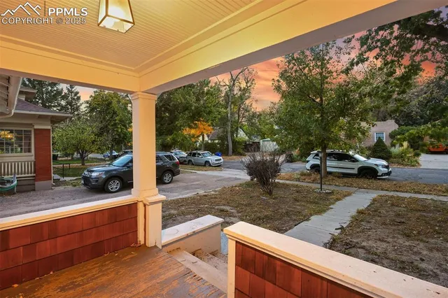 a living room with furniture and large windows
