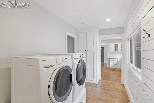 a view of a hallway with washer and dryer