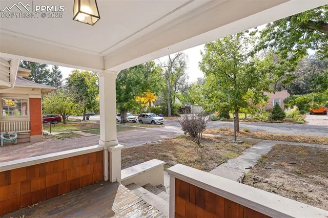 a view of a porch with wooden floor