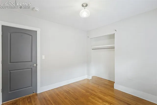 a living room with furniture a fireplace and a chandelier