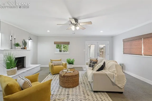 a living room with furniture and a fireplace