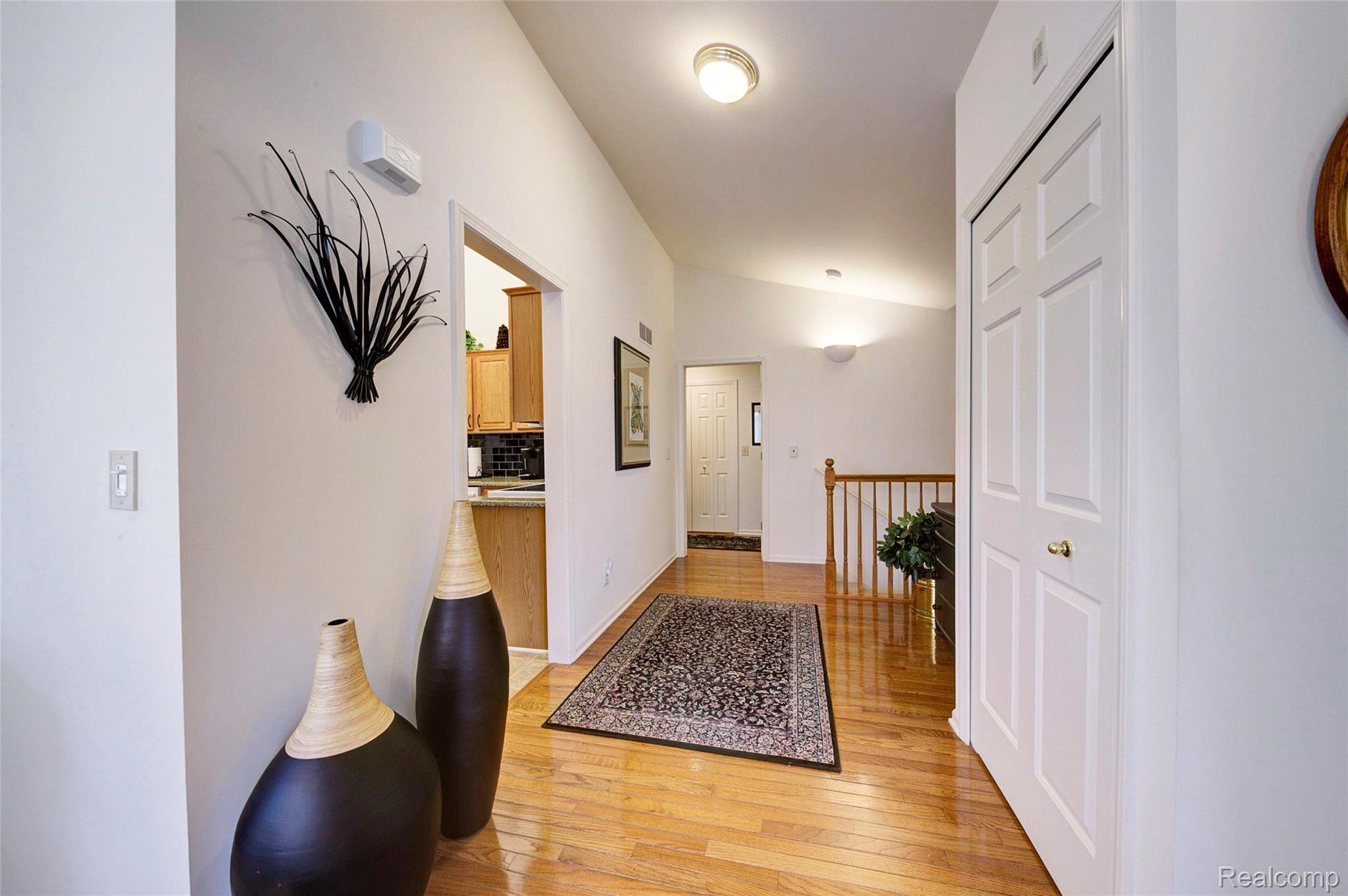 2577 Cleveland Way Canton, MI 48188 - Photo 6 of 34 Corridor featuring light wood finished floors and lofted ceiling
