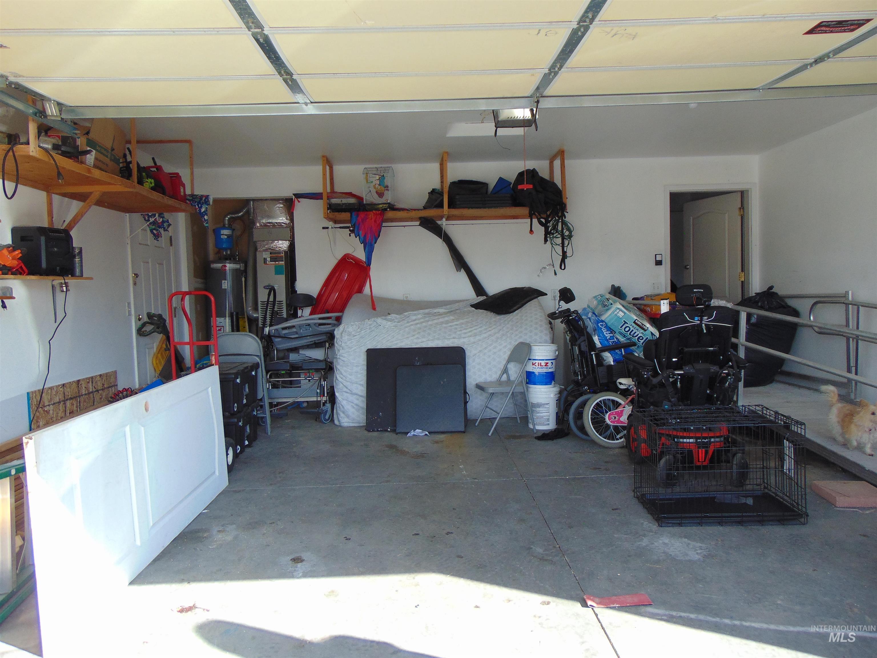 30 Maple Drive Weiser, ID 83672 - Photo 13 of 17 Garage featuring gas water heater and heating unit