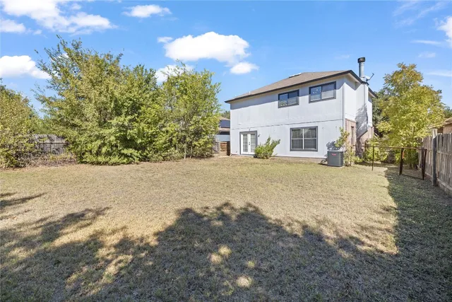 a view of a house with a yard covered in snow