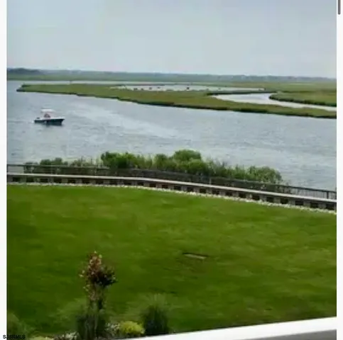 a view of a lake with a big yard