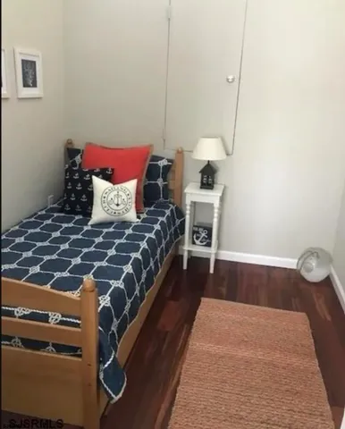 a bedroom with a bed and a table