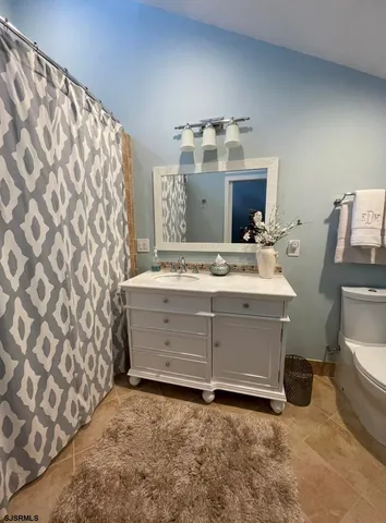 a room with a bed and a television