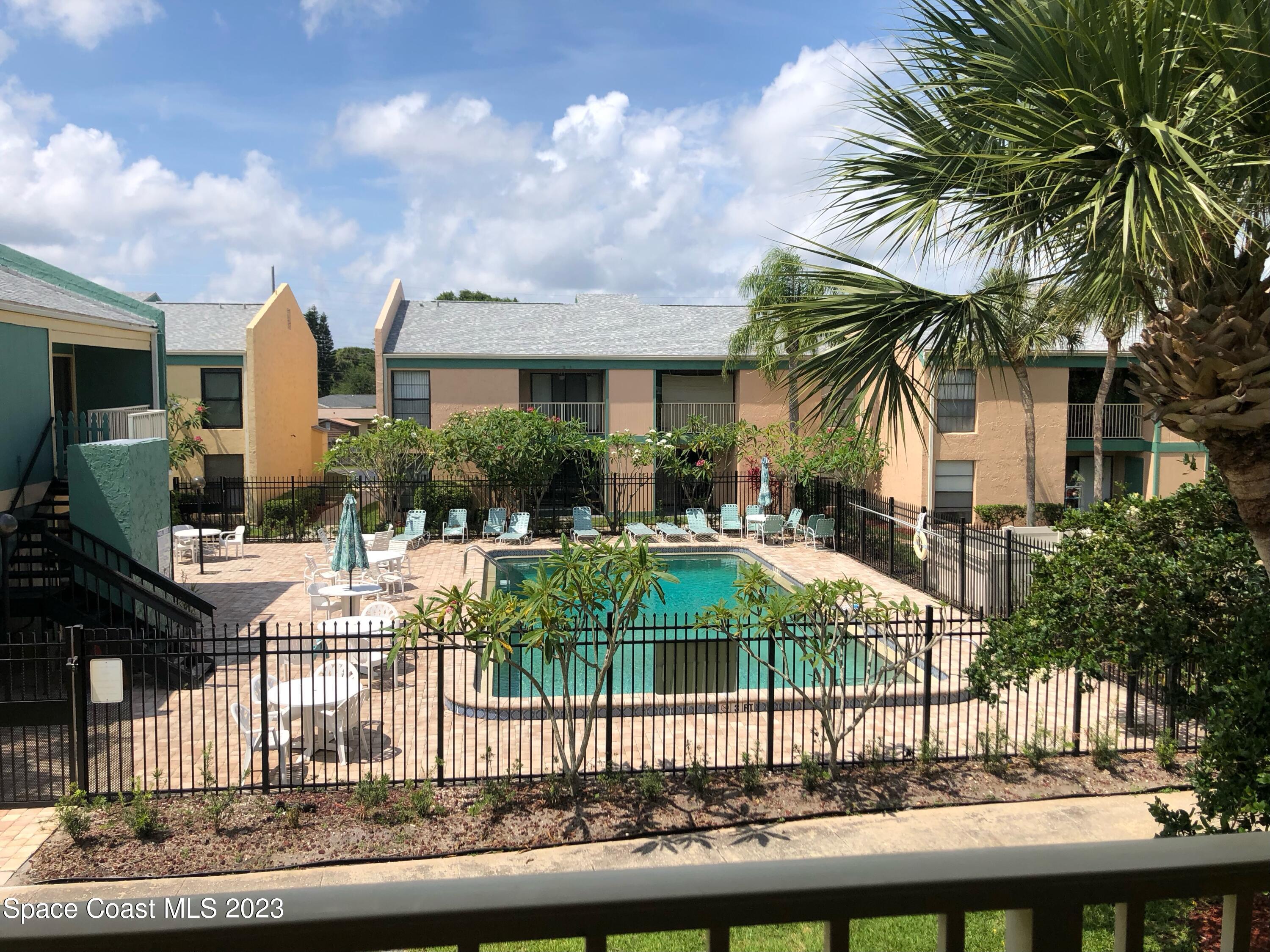 1225 North Wickham Road, Unit 721 Melbourne, FL 32935 - Photo 2 of 18 View of the pool from the balcony