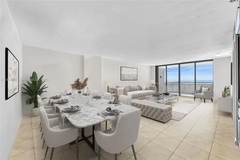 a view of a livingroom and dining room with furniture