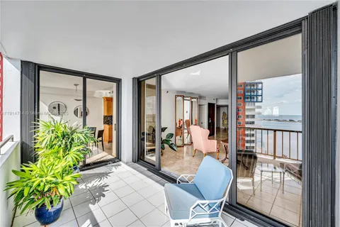 a kitchen with stainless steel appliances granite countertop a kitchen island a table and chairs in it