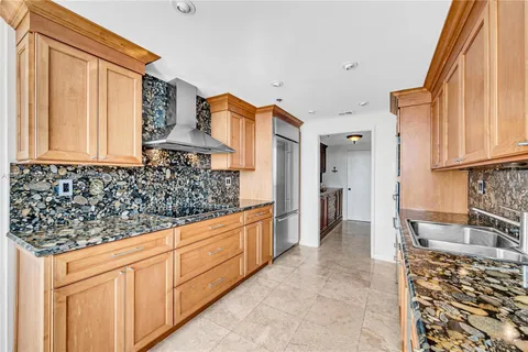 a spacious bedroom with a large bed and a large window