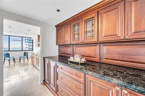 a bedroom with a bed and a night stand