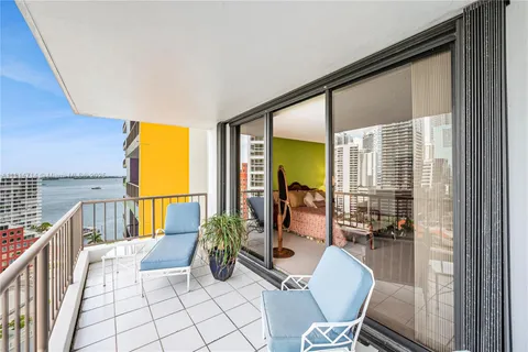 a bathroom with a tub sink shower and mirror