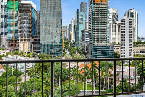 a bathroom with a granite countertop sink a toilet a mirror a vanity and shower