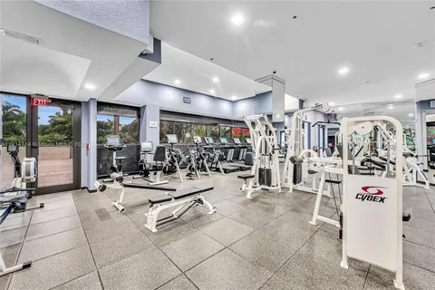 an aerial view of a houses with a yard