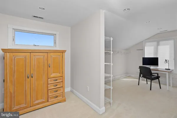 a living room with furniture fireplace and flat screen tv