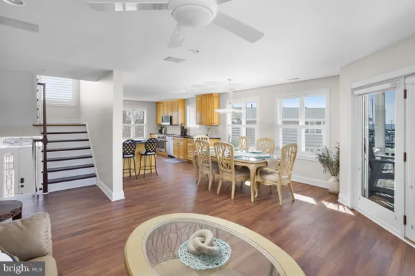 a view of a dining room with furniture window and wooden floor