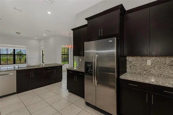 a spacious bathroom with a bathtub sink and mirror