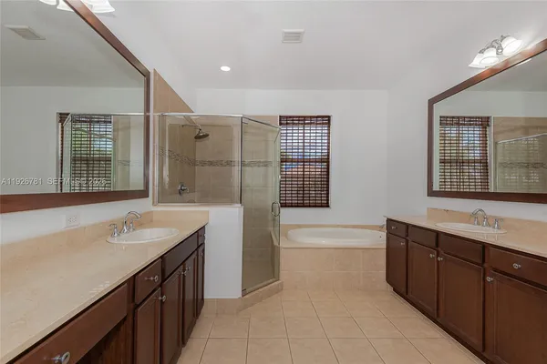 an empty room with wooden floor and closet
