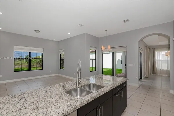 a living room with a couch and a window