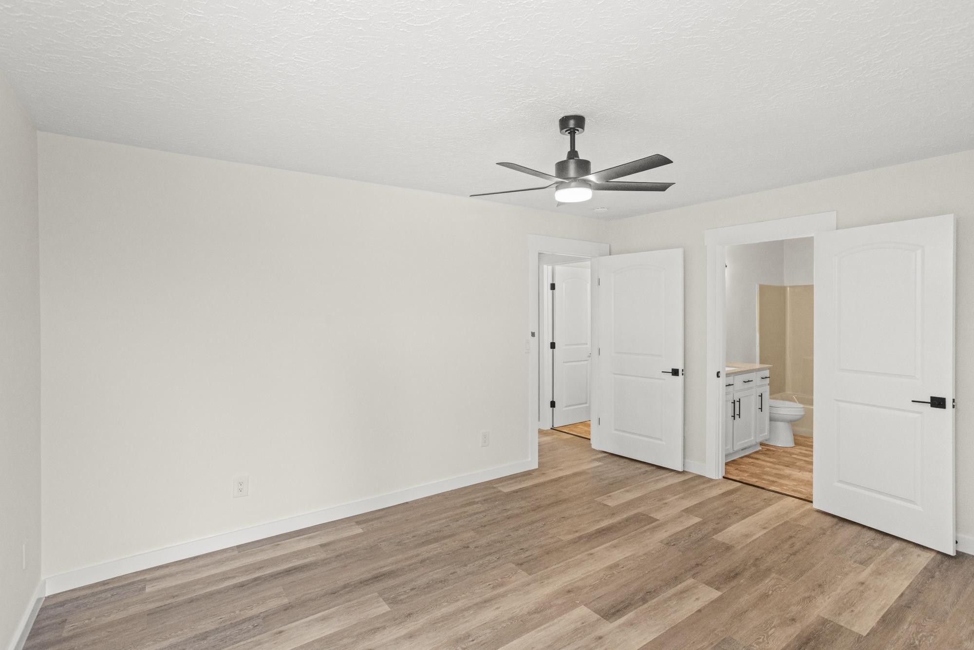 1053 Johns Road Joelton, TN 37080 - Photo 27 of 83 a view of an empty room with a ceiling fan