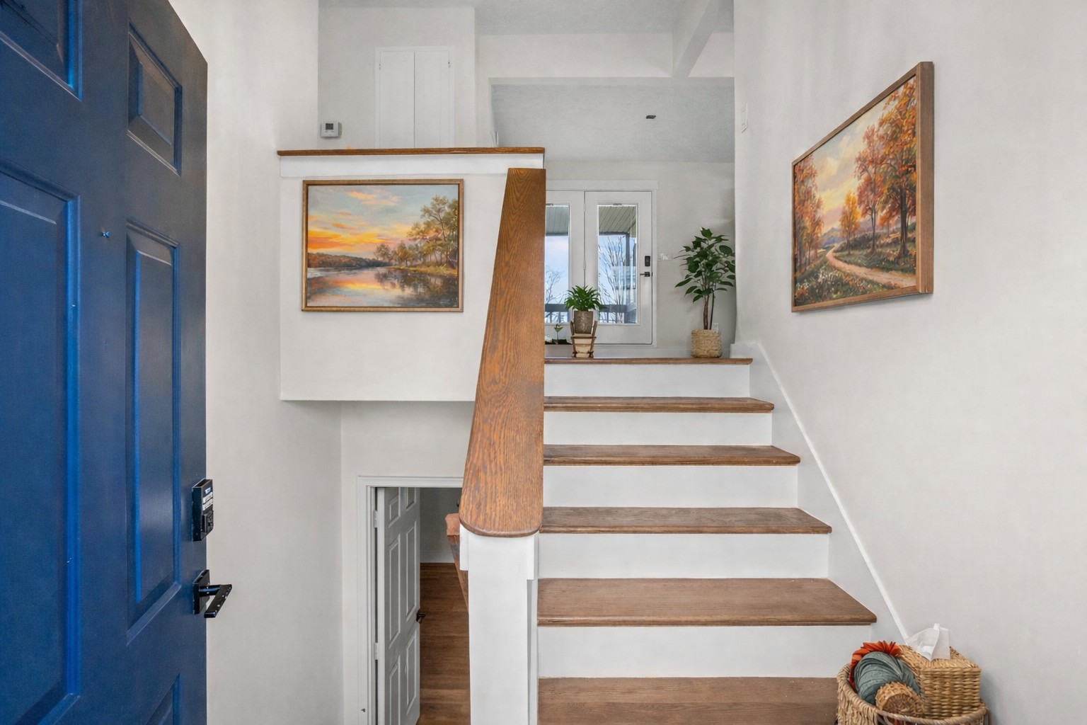 1053 Johns Road Joelton, TN 37080 - Photo 4 of 83 a view of staircase with white walls and a painting on the wall