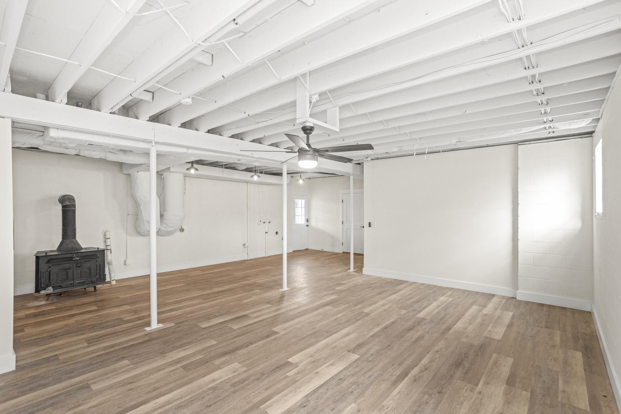 1053 Johns Road Joelton, TN 37080 - Photo 44 of 83 a view of an empty room with wooden floor