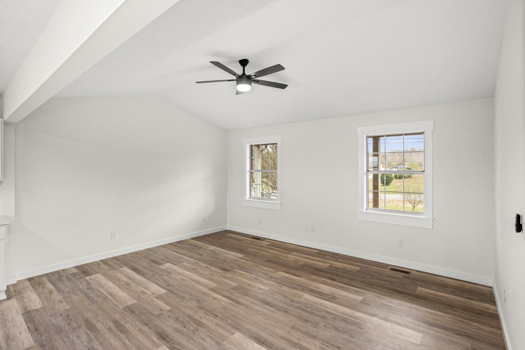 1053 Johns Road Joelton, TN 37080 - Photo 8 of 83 a view of empty room with wooden floor and fan