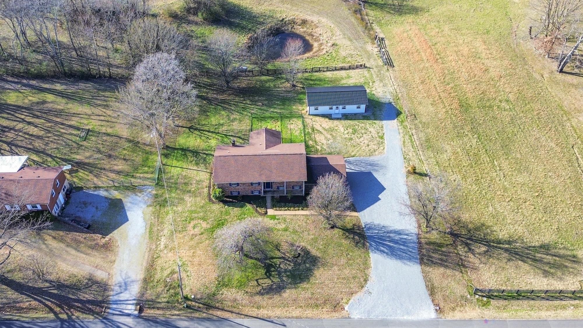 1053 Johns Road Joelton, TN 37080 - Photo 81 of 83 a backyard of a house with yard and outdoor seating