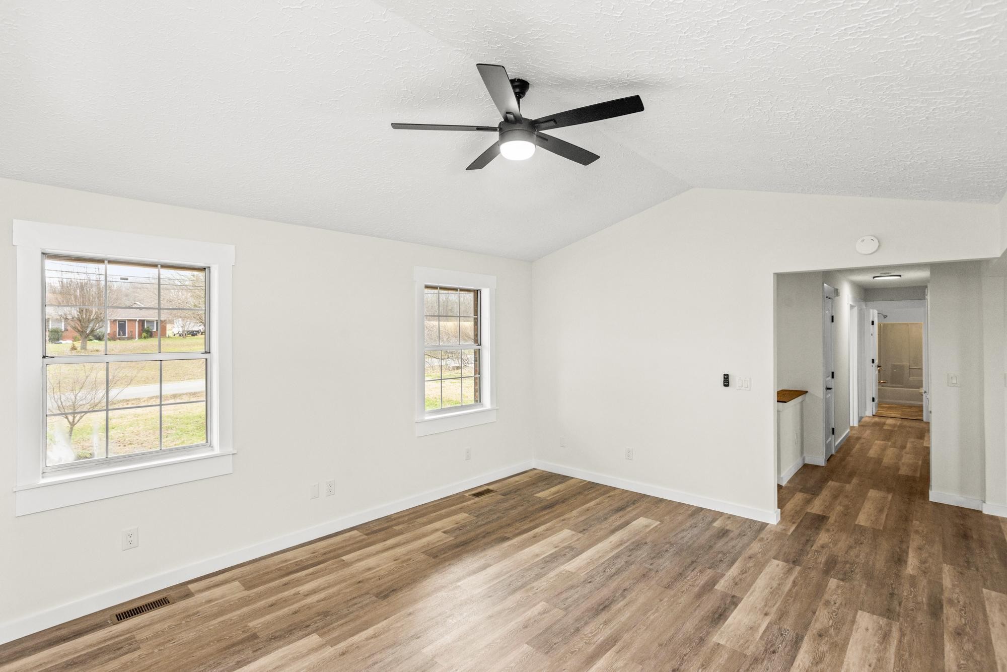 1053 Johns Road Joelton, TN 37080 - Photo 10 of 83 a view of empty room with wooden floor and fan