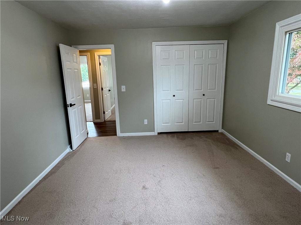 1715 Toepfer Road Akron, OH 44312 - Photo 16 of 49 Unfurnished bedroom with carpet and a closet