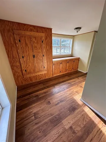 a view of entryway with wooden floor