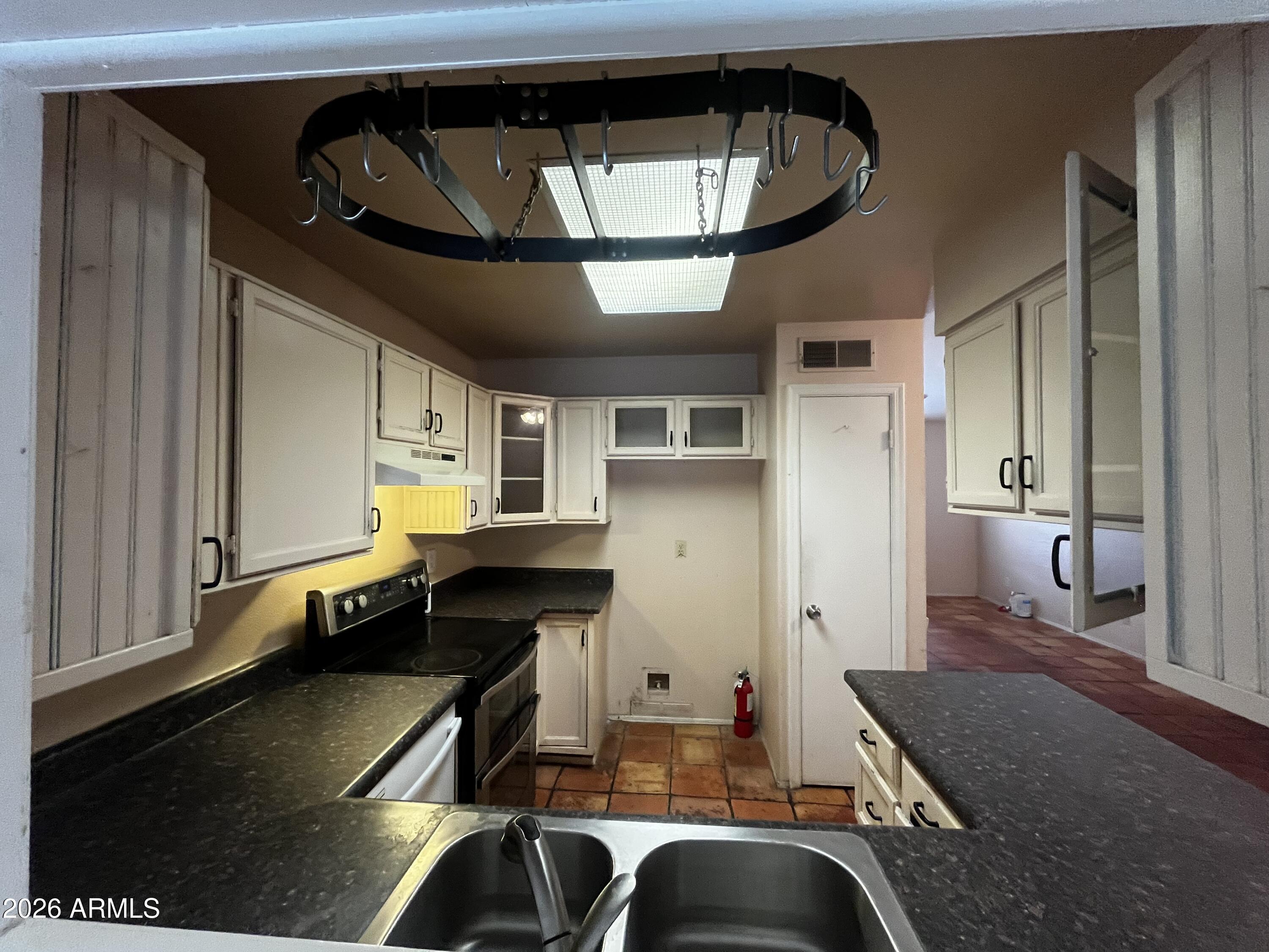 5922 West Hearn Road Glendale, AZ 85306 - Photo 16 of 45 kitchen through opening