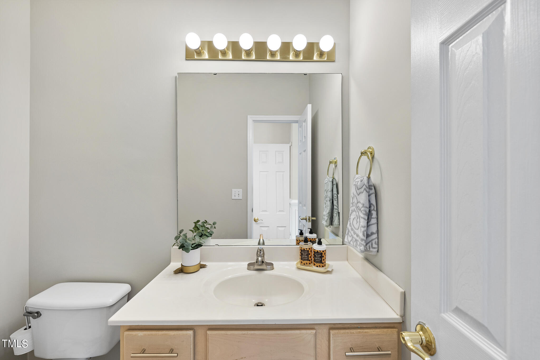 9013 Miranda Drive Raleigh, NC 27617 - Photo 18 of 41 a bathroom with a sink and a toilet