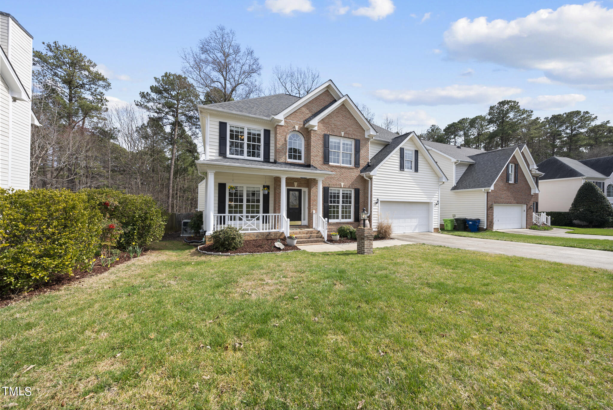 9013 Miranda Drive Raleigh, NC 27617 - Photo 2 of 41 a front view of a house with a yard porch and seating area
