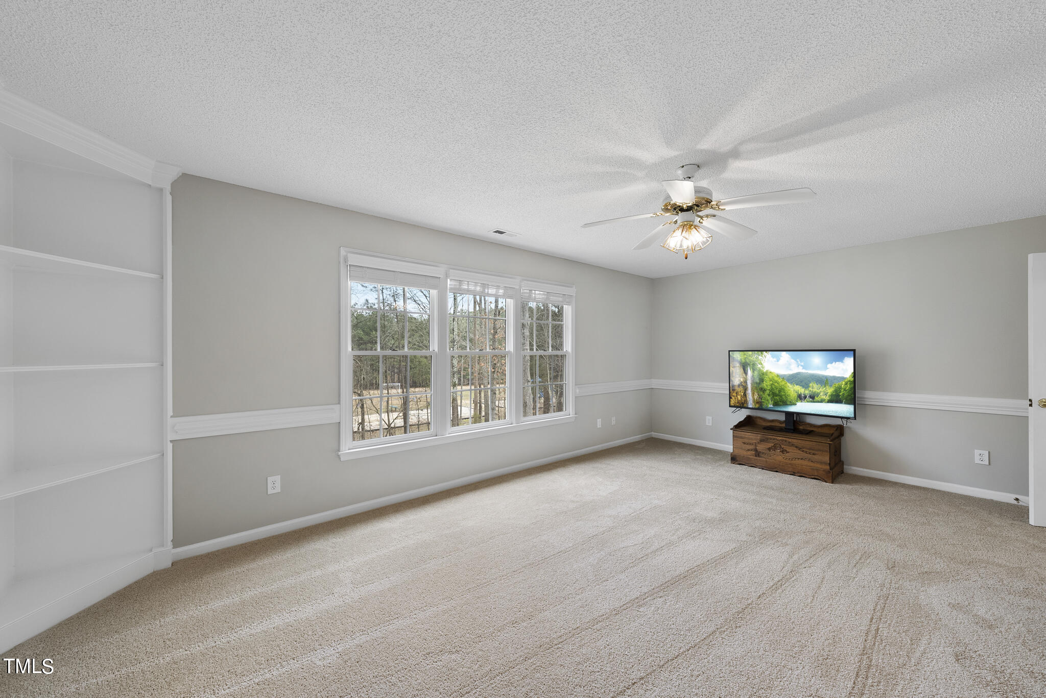 9013 Miranda Drive Raleigh, NC 27617 - Photo 21 of 41 a view of livingroom with furniture window and fireplace