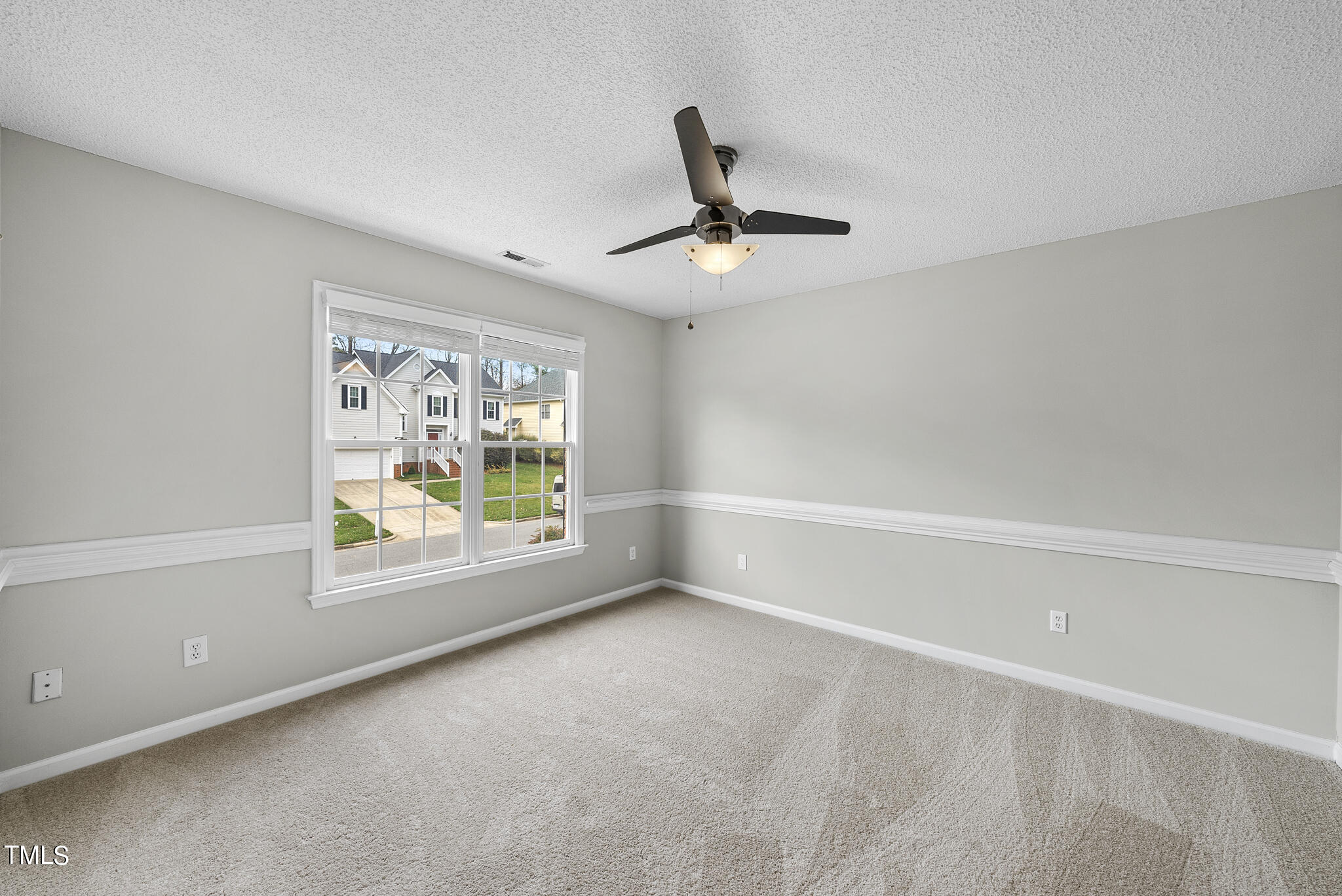 9013 Miranda Drive Raleigh, NC 27617 - Photo 28 of 41 a view of an empty room with a window